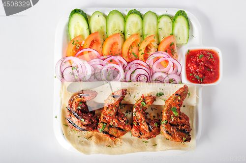 Image of Grilled lamb tongues with fresh vegetables salad