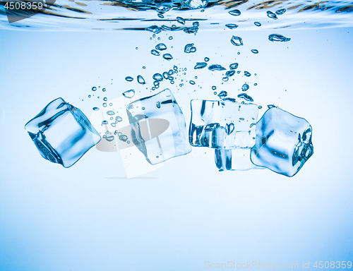 Image of Ice cubes falling under water