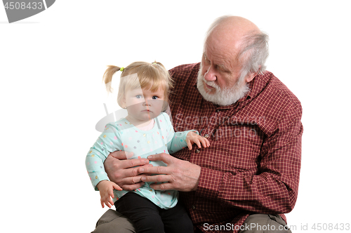 Image of Old good grandpa and his little granddaughter