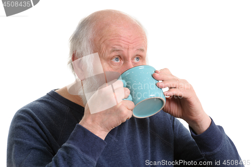 Image of Elderly man drinking from mug, isolated on white