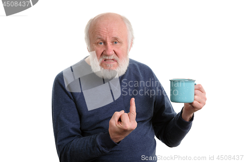 Image of senior man with cup shows middle finger isolated on white