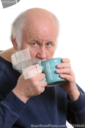 Image of Elderly man drinking from mug, isolated on white