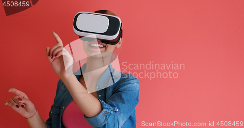 Image of young girl using VR headset glasses of virtual reality