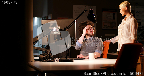 Image of young designers in the night office
