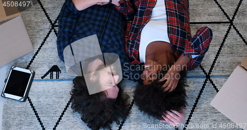 Image of Top view of attractive young multiethnic couple