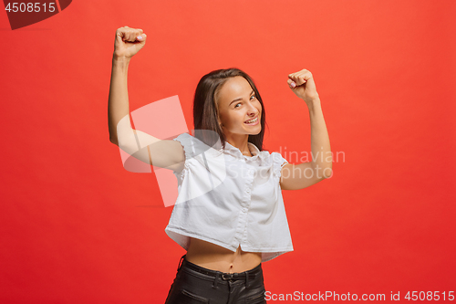 Image of Winning success woman happy ecstatic celebrating being a winner. Dynamic energetic image of female model