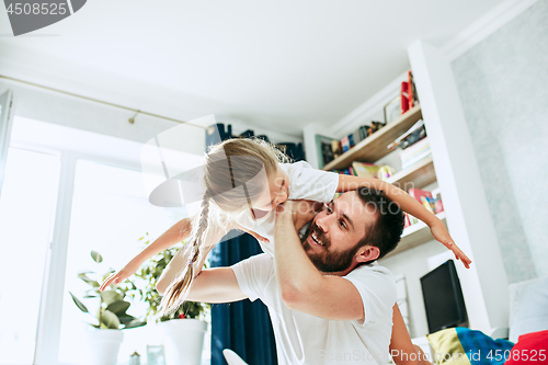 Image of Father and his six years kid girl at home