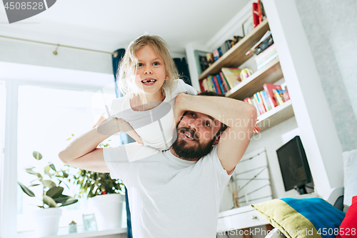 Image of Father and his six years kid girl at home