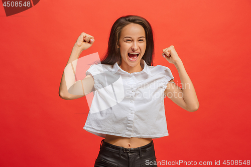 Image of Winning success woman happy ecstatic celebrating being a winner. Dynamic energetic image of female model