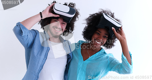 Image of multiethnic couple getting experience using VR headset glasses