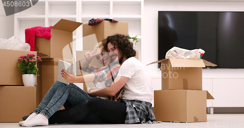 Image of young couple moving  in new house