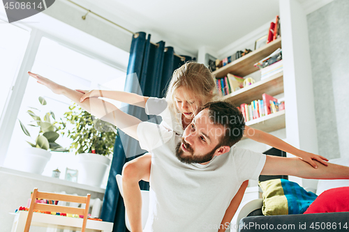 Image of Father and his six years kid girl at home