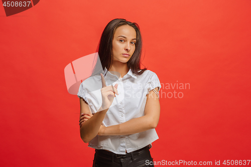 Image of Young serious thoughtful business woman. Doubt concept.