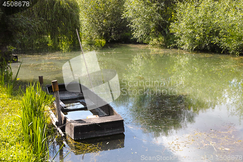 Image of Small boat in marshes in Bourges