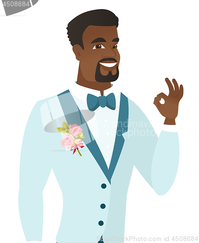 Image of Young african-american groom showing ok sign.