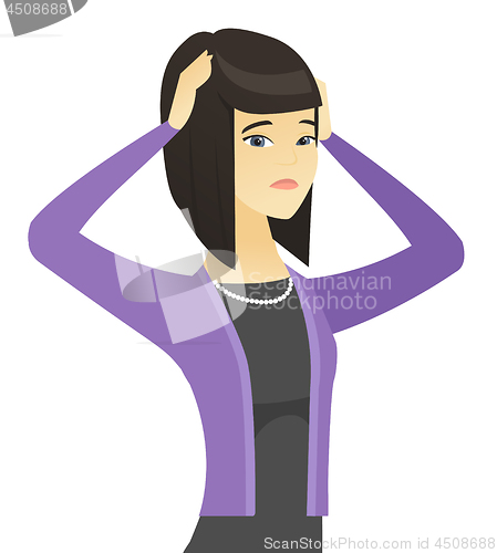 Image of Asian worried business woman with hands on head.