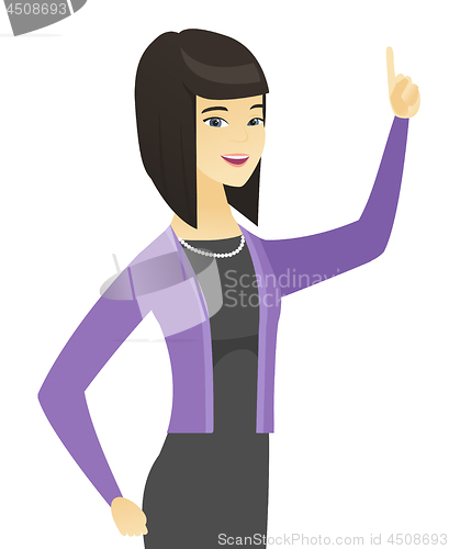 Image of Asian business woman pointing her forefinger up.