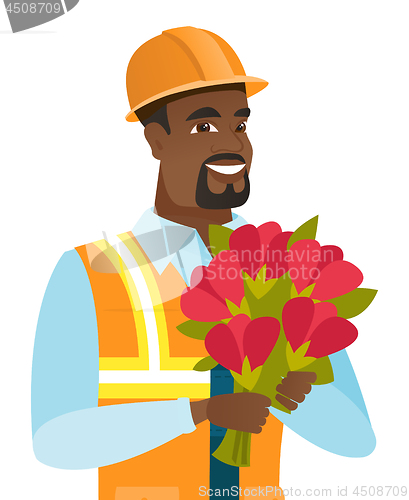 Image of Young african-american builder with bouquet.
