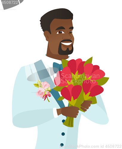 Image of Young african-american groom with bridal bouquet.