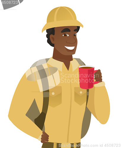 Image of African-american traveler holding cup of coffee.