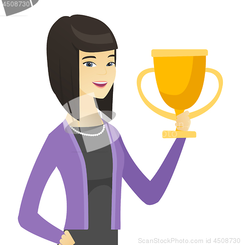 Image of Asian business woman holding a trophy.