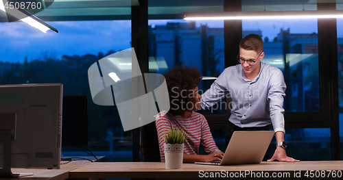 Image of Multiethnic startup business team in night office