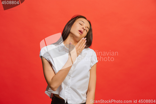 Image of Beautiful bored woman bored isolated on red background