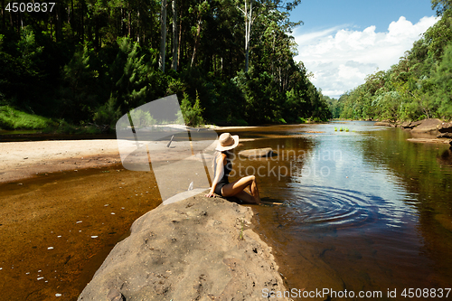 Image of Woman relaxing along the shallows of the Grose River