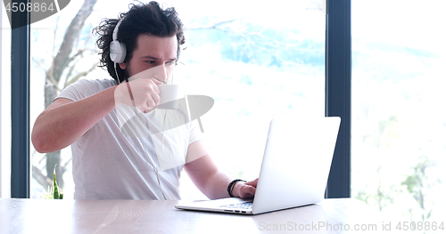 Image of man drinking coffee enjoying relaxing lifestyle