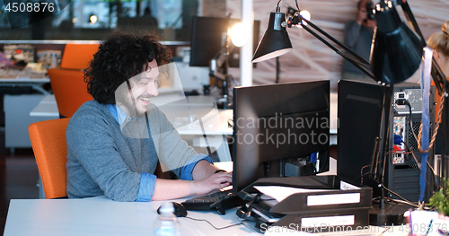 Image of businessman working using a computer in startup office