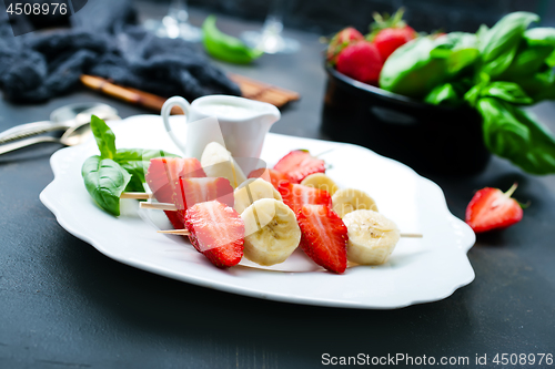 Image of banana with strawberry
