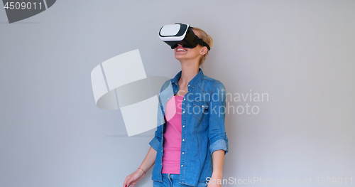 Image of girl using VR headset glasses of virtual reality
