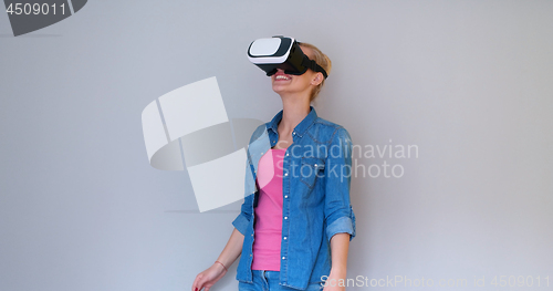Image of girl using VR headset glasses of virtual reality