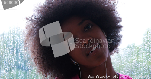 Image of portrait of young afro american woman in gym