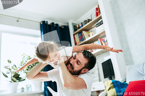 Image of Father and his six years kid girl at home