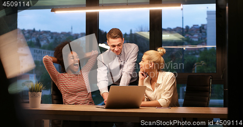 Image of Multiethnic startup business team in night office