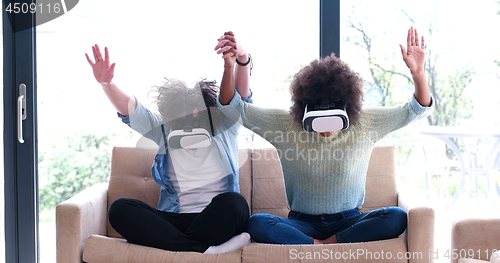 Image of Multiethnic Couple using virtual reality headset