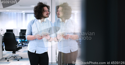Image of businessman using tablet computer