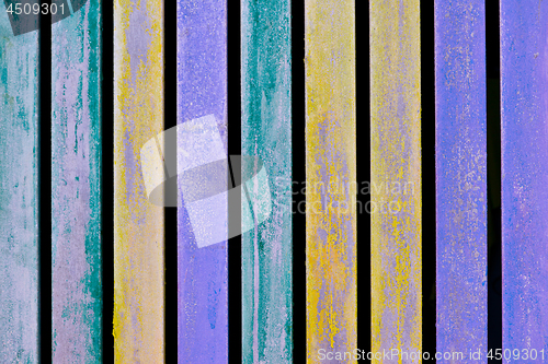 Image of Colorful blue, yellow and turquoise wooden aged plank wall.