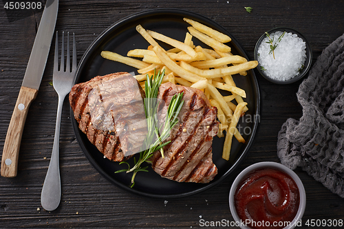 Image of grilled steak and fried potatoes