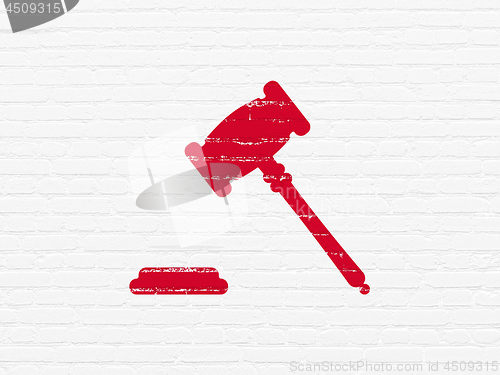 Image of Law concept: Gavel on wall background