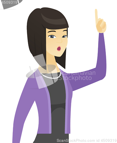 Image of Business woman with open mouth pointing finger up.