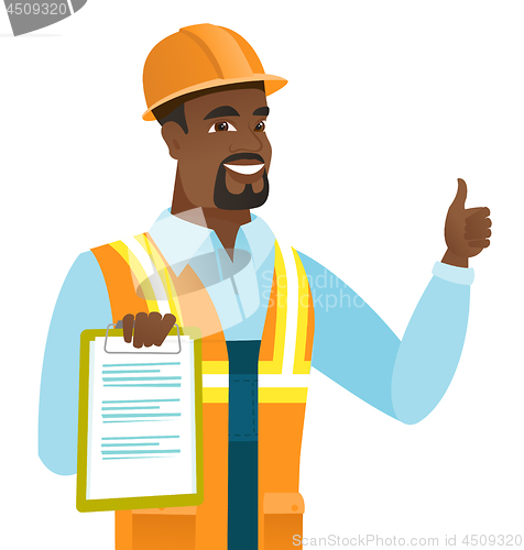 Image of African builder with clipboard giving thumb up.