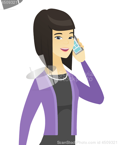 Image of Asian business woman talking on a mobile phone.