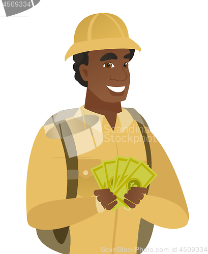 Image of Young african-american traveler holding money.