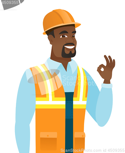 Image of African-american smiling builder showing ok sign.