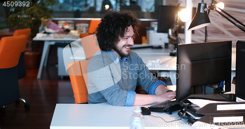 Image of businessman working using a computer in startup office