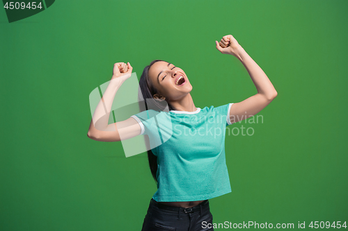 Image of Winning success woman happy ecstatic celebrating being a winner. Dynamic energetic image of female model