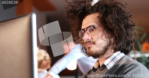 Image of businessman working using a computer in startup office