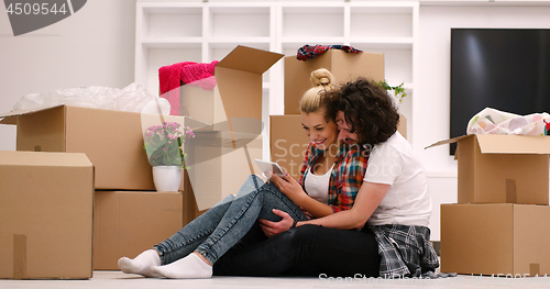 Image of young couple moving  in new house